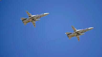 MOSCOW, RUSSIA - MAY 7, 2021: Avia parade in Moscow. jet fighter aircraft Su-24 in the sky on...
