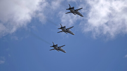 MOSCOW, RUSSIA - MAY 7, 2021: Avia parade in Moscow. jet fighter aircraft Su-24 in the sky on parade of Victory in World War II in Moscow, Russia
