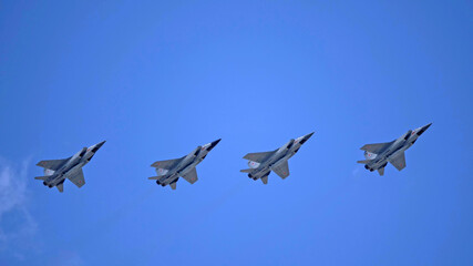 MOSCOW, RUSSIA - MAY 7, 2021: Avia parade in Moscow. group jet fighter aircraft Mikoyan MiG-31 in the sky on parade of Victory in World War II in Moscow, Russia