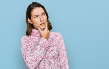 Young caucasian girl wearing wool winter sweater thinking worried about a question, concerned and nervous with hand on chin