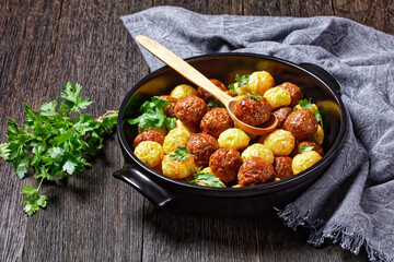 Meatballs and spaghetti balls top view, close-up