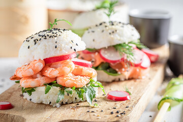 Unique sush burger with salmon and avocado as Japanese appetizers.