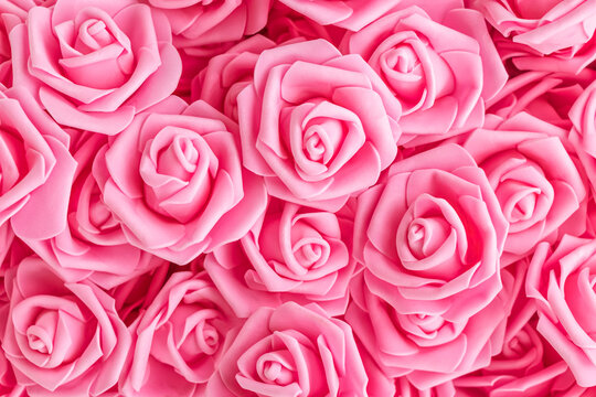 background of pink flowers. Artificial pink roses, foamiran roses. fake flowers.