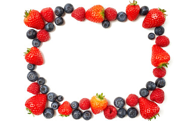 A frame from raspberries, strawberries and blueberries on a white background.