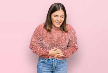 Young beautiful woman wearing casual clothes with hand on stomach because nausea, painful disease feeling unwell. ache concept.
