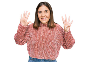 Young beautiful woman wearing casual clothes showing and pointing up with fingers number nine while...