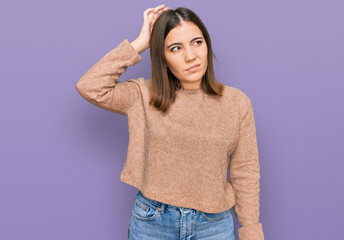 Young beautiful woman wearing casual clothes confuse and wondering about question. uncertain with...