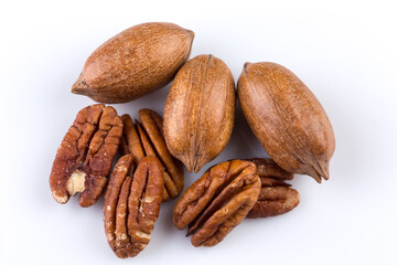 Few pecan nuts isolated on white
