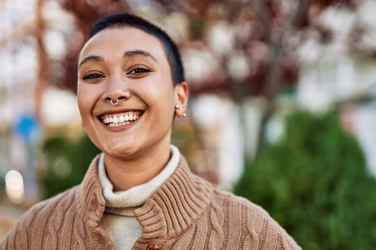 Beautiful Hispanic Woman With Short Hair Smiling Happy Outdoors