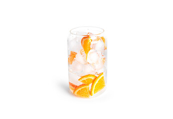Soda with orange slices and ice in a glass isolated on a white background.