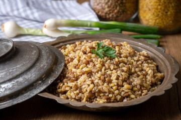 Traditional delicious Turkish foods; bulgur pilaf with green lentils (Turkish name; yesil mercimekli bulgur pilavi)