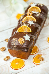 Home Made Panettone. Traditional Italian sweet bread. Panettone with a slice served on a wooden table.
