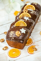 Home Made Panettone. Traditional Italian sweet bread. Panettone with a slice served on a wooden table.