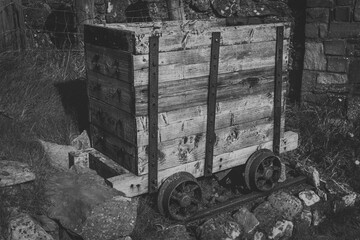Old Rusty Wooden Mine Cart Outdoors in Black and White