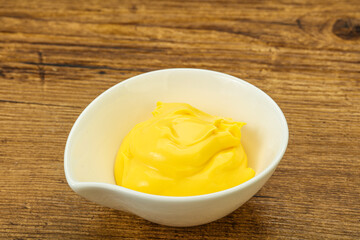 Natural cheese sauce in the bowl