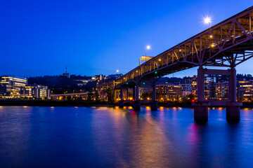 Colorful cityscape of Portland  over Willamette  river at twilight