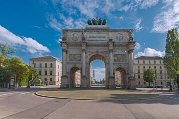 The Siegestor, The Victory Gate, a triumphal arch crowned with a statue of Bavaria with a lion-quadriga. The gate was designed by Friedrich von Gärtner and Eduard Mezger in 1852. Munich, May 2014 - obrazy, fototapety, plakaty