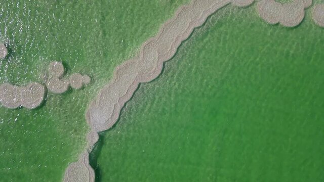 Aerial Shot Of Salt Formations At Beautiful Dead Sea, Drone Panning From Left To Right Over Lake