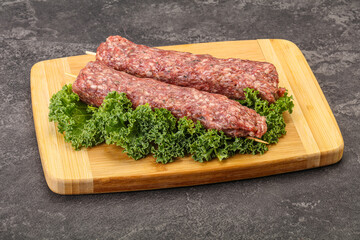 Raw minced beef kebab skewer