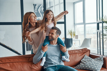 Happy young family smiling and embracing