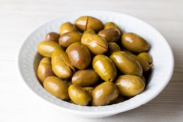 Cracked green olives. Cracked green olives with lemon. Turkish style olive (Turkish name; kirma zeytin)