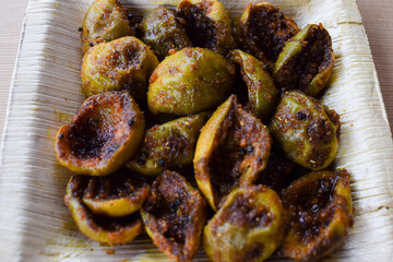 Tasty Goonda or Gunde ki sabzi also known as Gumberry or glue berry vegetable home cooked with Indian masala. Seasonal sabji fruit side dish eaten with chapati or rice. Also known as Lasoda or lasura