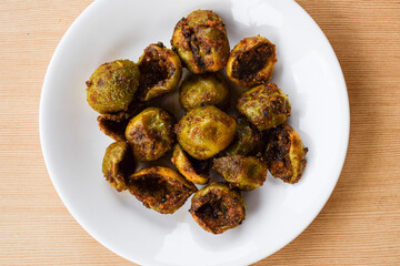 Tasty Goonda or Gunde ki sabzi also known as Gumberry or glue berry vegetable home cooked with Indian masala. Seasonal sabji fruit side dish eaten with chapati or rice. Also known as Lasoda or lasura