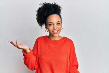 Young african american girl wearing casual clothes smiling cheerful with open arms as friendly welcome, positive and confident greetings