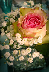 Obraz na płótnie Canvas Bouquet with rose on the table