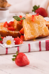 Lemon pund cake with honey and fresh strawberries.