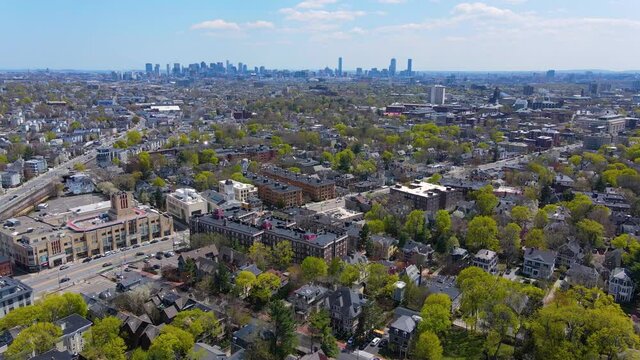 Porter Square aerial view on Somerville Avenue at Massachusetts Avenue with Boston skyline at the background in spring, city of Cambridge, Massachusetts MA, USA. 