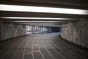 Empty modern pedestrian underpass with neon light