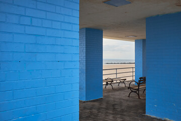 Blue brick walled shelter with bench at Coney Island