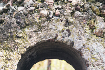 Fragment of the broken stone wall of the old fortress