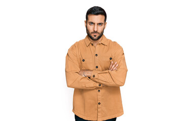Fototapeta premium Young hispanic man wearing casual clothes skeptic and nervous, disapproving expression on face with crossed arms. negative person.
