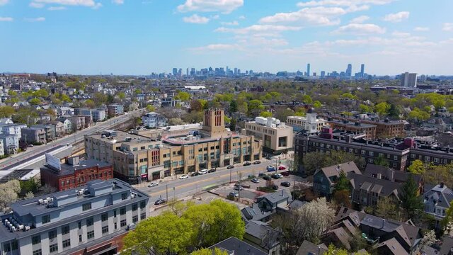Porter Square aerial view on Somerville Avenue at Massachusetts Avenue with Boston skyline at the background in spring, city of Cambridge, Massachusetts MA, USA. 