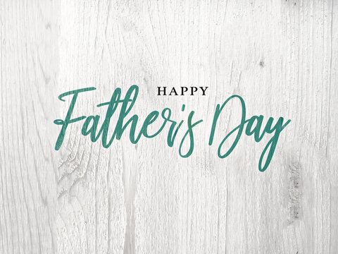 Happy Father's Day Green Calligraphy Script Over White Wood Texture Background