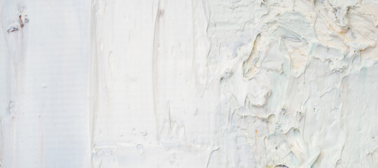 .Embossed pasty oil paints and reliefs. Primary colors: grey, white.  Abstract art. Mix of paints.