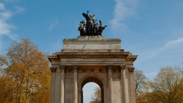 Walking towards Wellington Arch, or Constitution Arch, in Hyde Park Corner, London, UK, dedicated to 1st Duke of Wellington