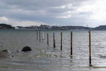 Electric fence for farm animals stretching into the sea. Shot in Sweden, Scandinavia