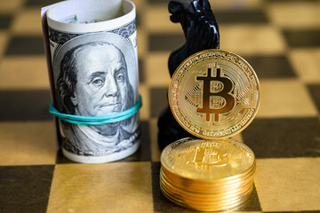 Dollars and bitcoin stack on chessboard. Cash, bit coins and chess figure