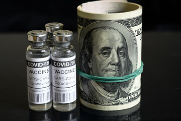 Coronavirus vaccine and dollar bills, COVID-19 drug and money