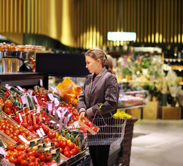 Woman buying fruits and vegetables  at the market