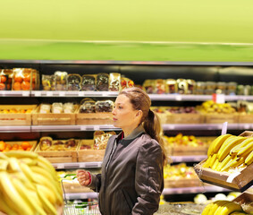 Woman buying fruits and vegetables  at the market