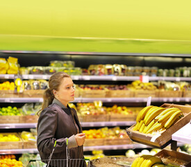 Woman buying fruits and vegetables  at the market