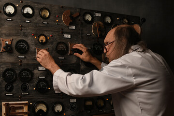 Scientist working in its laboratory, doing a physics experiment, with some vintage instruments