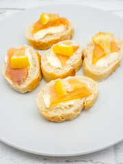 close up photo of assorted fish fillet starters with lemon on top