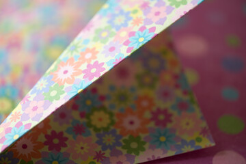 folded floral scrapbooking paper photographed using a macro lens, featuring a shallow depth of field