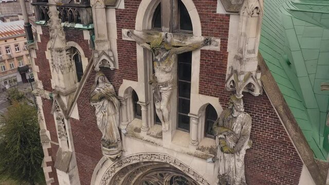 Aerial view of historical center of Church of St. Olga and Elizabeth old gothic temple in town Lviv, Ukraine. Flying by drone over dome. 4K UHD footage of landmarks, architecture of european Lvov city