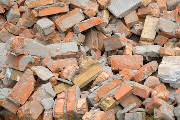A pile of red broken bricks. Brick background